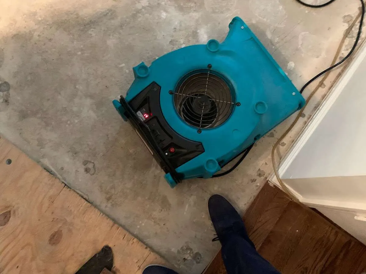 Air mover drying subfloor during Leak Detection & Repair in Port Salerno